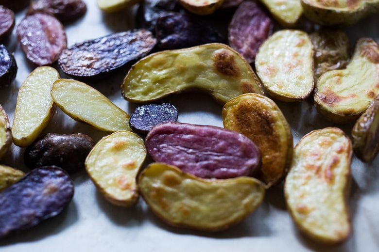 Roasted Romesco Potatoes- a simply tasty recipe for Roasted Fingerling Potatoes with a flavorful 5 minute Romesco Sauce, made w/ simply pantry ingredients you probably already have! | www.feastingathome.com