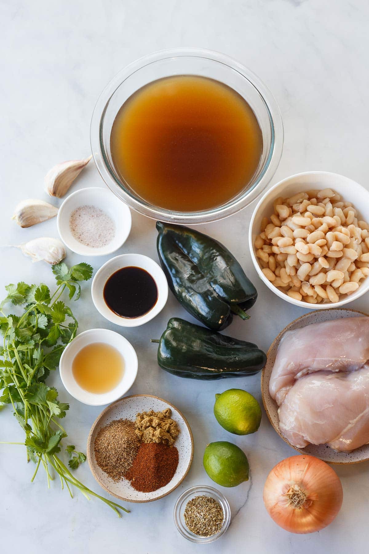 white chicken chili ingredients on a white counter.