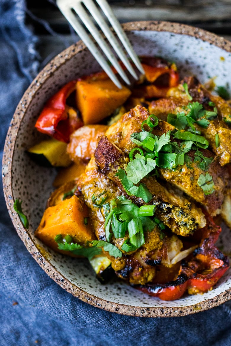 Baked Tandoori Chicken (or Tofu) with "clean-out-your-fridge veggies" and flavorful tandoori marinade, all cooked on a sheet-pan. Delicious, healthy recipe! Vegetarian Adaptable! #tandoorichicken #bakedtandoorichicken #tandooritofu