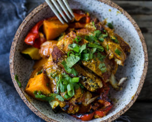 Baked Tandoori Chicken (or Tofu) with "clean-out-your-fridge veggies" and flavorful tandoori marinade, all cooked on a sheet-pan. Delicious, healthy recipe! Vegetarian Adaptable! #tandoorichicken #bakedtandoorichicken #tandooritofu