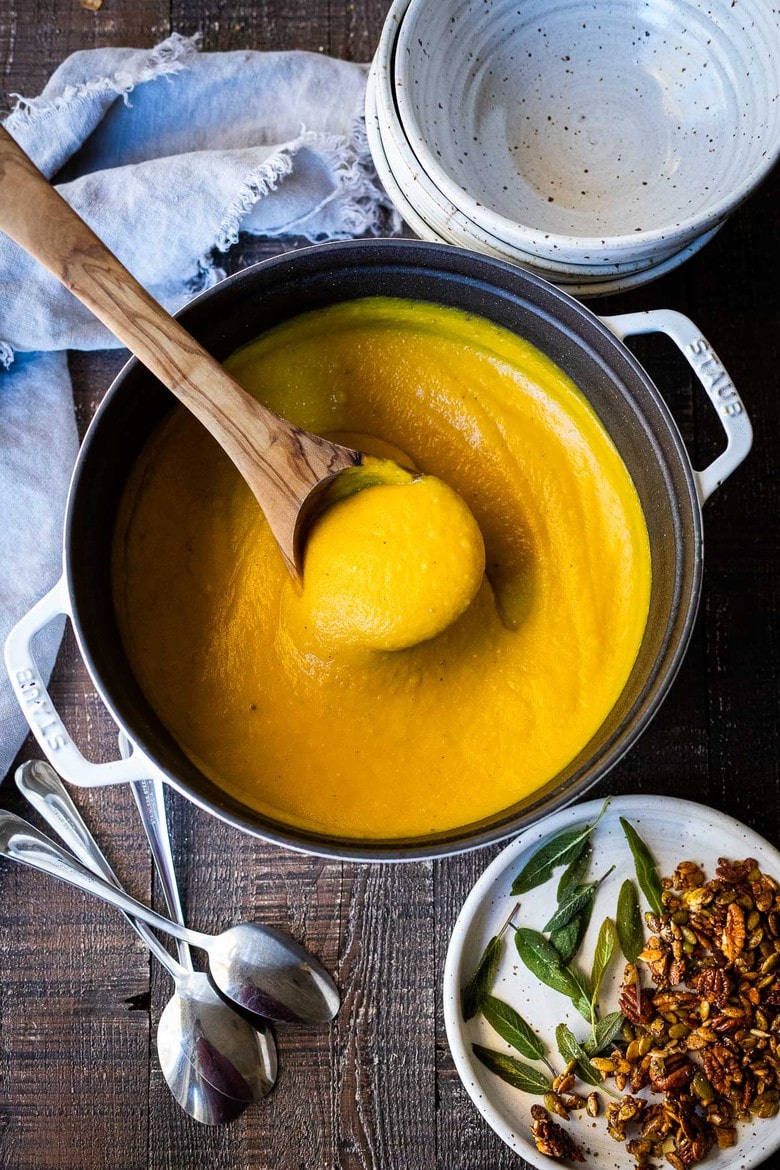 Roasted Butternut Squash Soup. This creamy fall soup is full of flavor and vegan-adaptable and gluten free. | #butternutsoup #butternut #vegan #fallsoup #roastedbutternutsoup www.feastingathome.com 