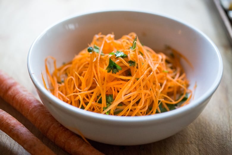 Fall Nourish Bowl- Curried cauliflower, lentils, brown rice, kale and a refreshing Carrot Slaw topped with Turmeric vinaigrette. VEGAN & Gluten-free. | www.feastingathome.com