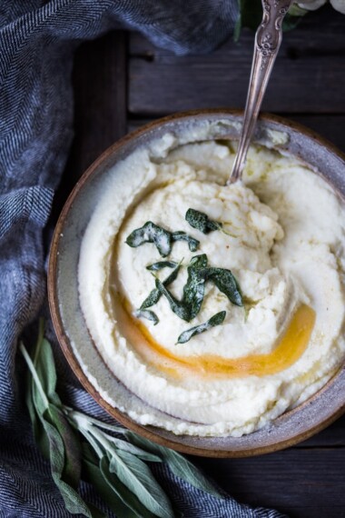 Mashed Cauliflower with Roasted Garlic, an easy delicious alternative to mashed potatoes, keto friendly, low carb, healthy and full of amazing flavor! The perfect side dish to any occasion! Vegan adaptable and gluten-free! #feastingathome #mashedcauliflower #cauliflowermashedpotatoes #cauliflowermash #vegan