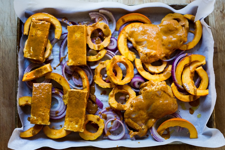 Baked Tandoori Chicken (or Tofu) with "clean-out-your-fridge veggies" and flavorful tandoori marinade, all cooked on a sheet-pan. Delicious, healthy recipe! Vegetarian Adaptable! #tandoorichicken #bakedtandoorichicken #tandooritofu