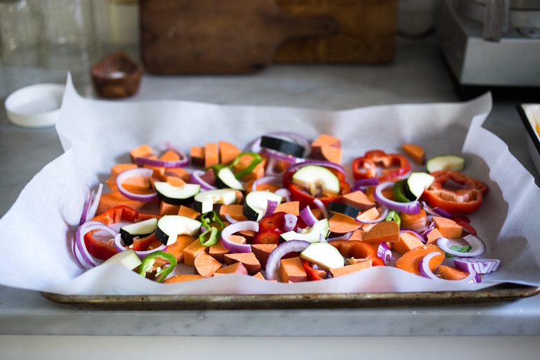 Sheet-Pan Tandoori Bake with "clean-out-your-fridge veggies" and your choice of chicken, tofu or fish. Delicious, healthy recipe! | www.feastingathome.com