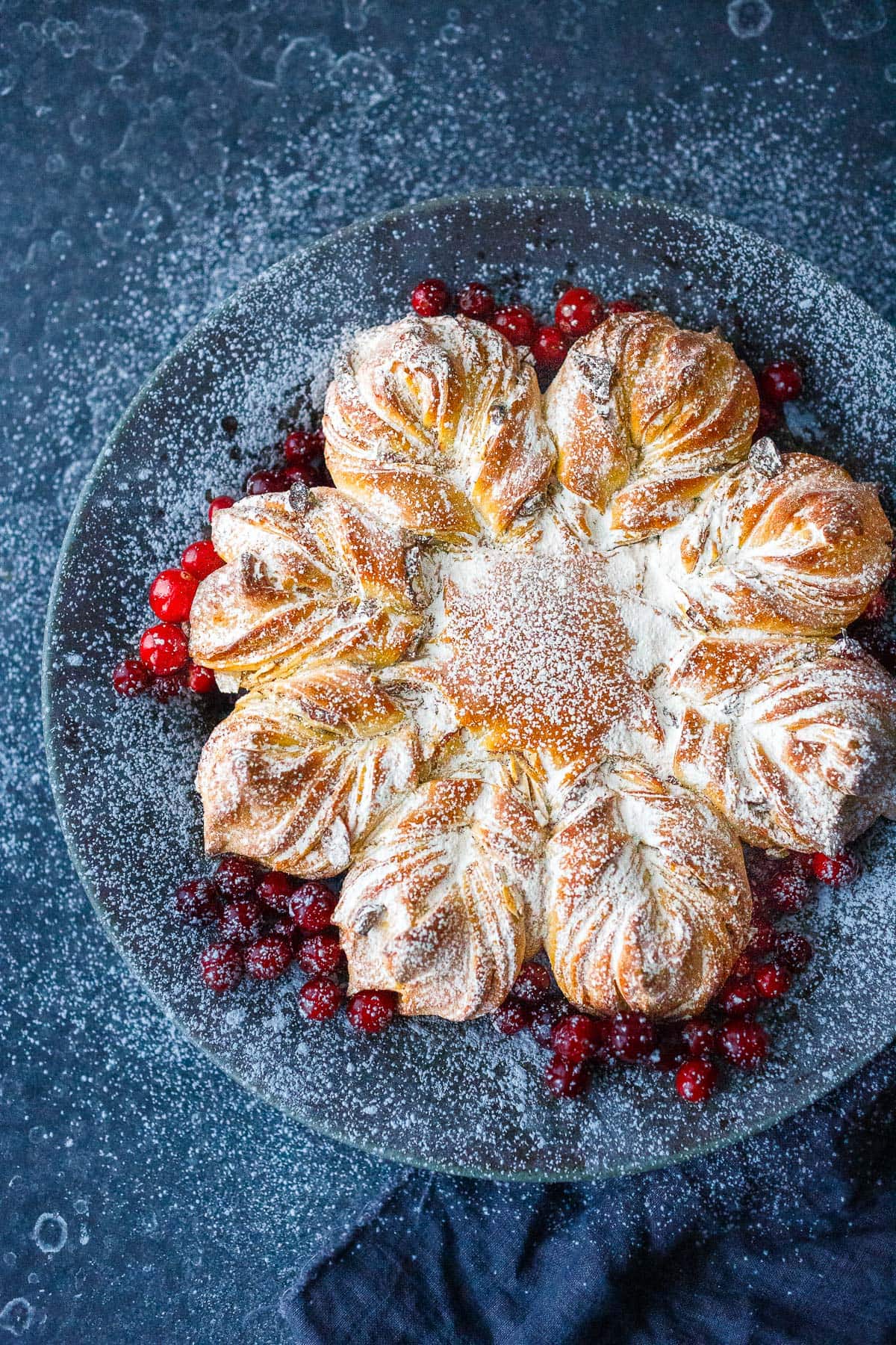  This cardamom-scented Star Bread recipe is so much fun to make! Deliciously fragrant, tender sweet bread, is studded with almonds and dried cranberries, perfect for holiday brunch or afternoon tea.