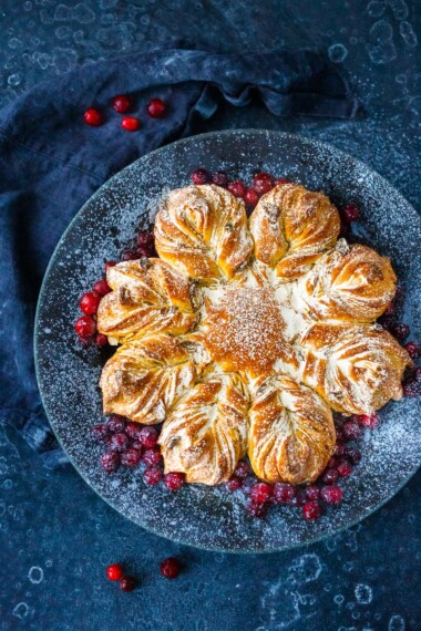  This cardamom-scented Star Bread recipe is so much fun to make! Deliciously fragrant, tender sweet bread, is studded with almonds and dried cranberries, perfect for holiday brunch or afternoon tea.