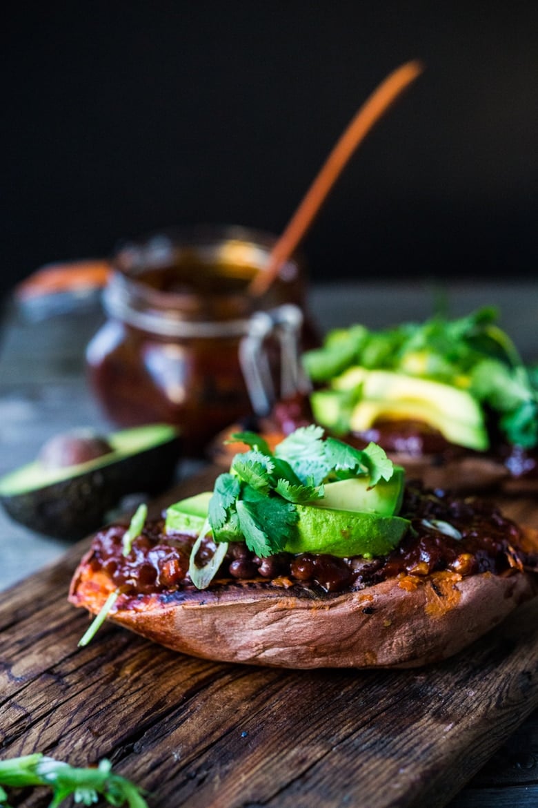 Baked Sweet Potatoes with BBQ Chicken ( or Black beans) or both! Perfect for mixed households who have meat-lovers, vegetarians, vegans, and gluten-free folks all living under the same roof. Customizable and adaptable! | #bakedsweetpotato | www.feastingathome.com