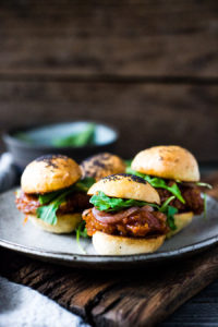 Vegan BBQ Sliders made with delicious "pulled" Spaghetti Squash, Pickled Onions and Arugula- a simple, tasty and healthy alternative to pulled pork! | #vegan #sliders #spaghettisquash #jackfruit #vegansliders #veganappetizer #bbq #appetizer #potluck |www.feastingathome.com