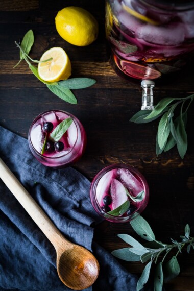 Blueberry Gin and Sage Punch with lemon and prosecco, the perfect make-ahead holiday sparkler. | www.feastingathome.com