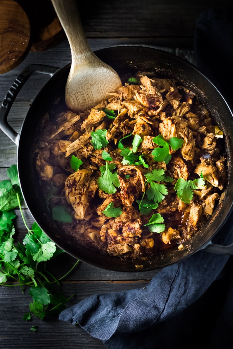 Chicken Carnitas- Make on the stovetop, in the oven, or in an Instant Pot with only 15 minutes of hands on time. Make ahead on Sunday then turn this into tacos, quesadillas, burrito bowls or nachos during the workweek! | www.feastingathome.com #instantpot #chickencarnitas #carnitas #instantpotcarnitas