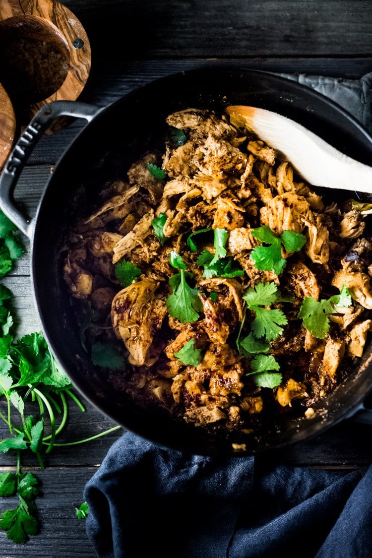 Chicken Carnitas- Make on the stovetop, in the oven, or in an Instant Pot with only 15 minutes of hands on time. Make ahead on Sunday then turn this into tacos, quesadillas, burrito bowls or nachos during the workweek! | www.feastingathome.com #instantpot #chickencarnitas #carnitas #instantpotcarnitas