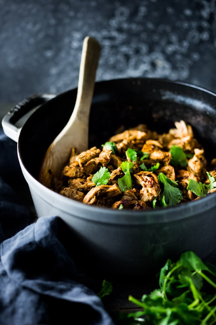 Chicken Carnitas- Make on the stovetop, in the oven, or in an Instant Pot with only 15 minutes of hands on time. Make ahead on Sunday then turn this into tacos, quesadillas, burrito bowls or nachos during the workweek! | www.feastingathome.com #instantpot #chickencarnitas #carnitas #instantpotcarnitas