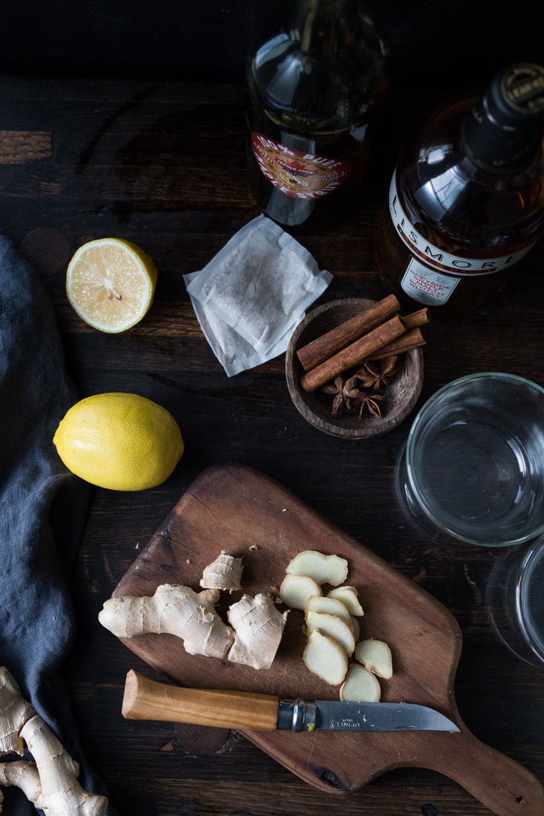 Maple Ginger Hot Toddy- made with whiskey, hot water, muddled ginger, maple or honey, whole spices and a squeeze of lemon- soothes a sore throat and warms the body. | www.feastingathome.commaple-ginger-hot-toddy-103