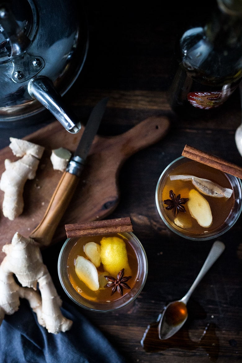 Maple Ginger Hot Toddy- made with whiskey, hot water, muddled ginger, maple or honey, whole spices and a squeeze of lemon- soothes a sore throat and warms the body. | www.feastingathome.com