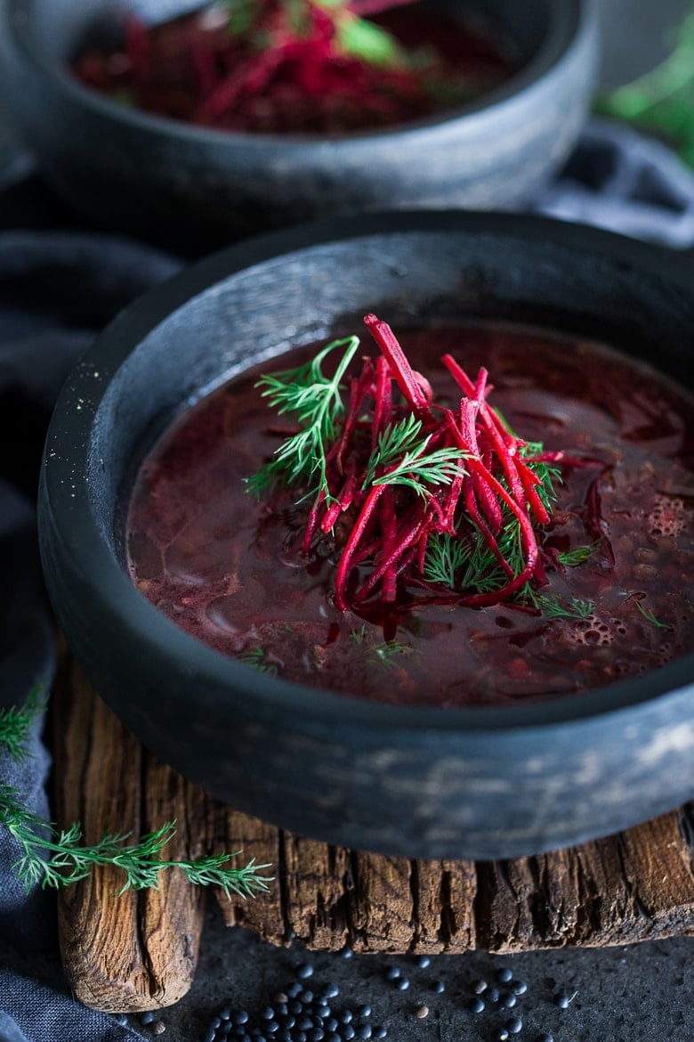 This healing Lentil Beet Soup is vegan, low-calorie,  and packed full of powerful antioxidants that gently aid the liver in healing the body. #detoxsoup #lentilsoup #vegansoup #beetsoup #detoxbroth #cleaneating #eatclean #plantbased | www.feastingathome.com