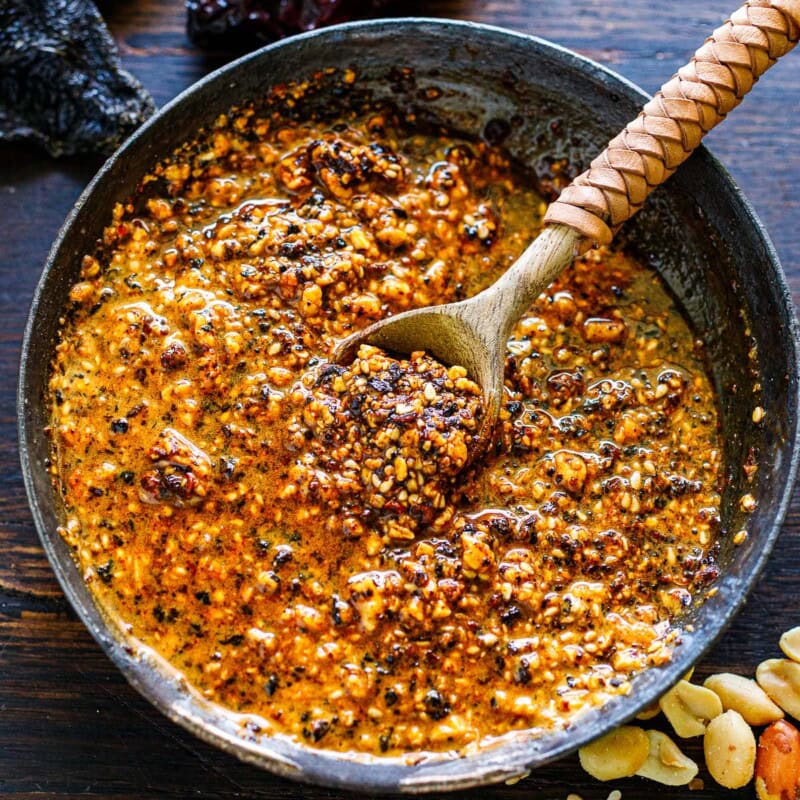 This salsa macha recipe is a delicious Mexican condiment you will fall in love with!  It's a flavorful chili oil made with crispy dried chilies, peanuts, sesame seeds, and garlic, perfect for drizzling over tacos or using as a marinade!