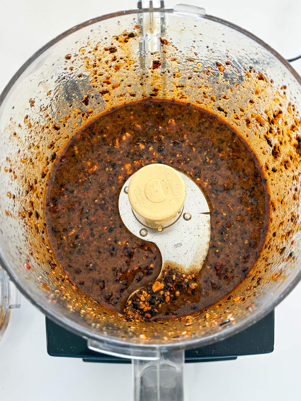 Blending the salsa macha in a food processor. 