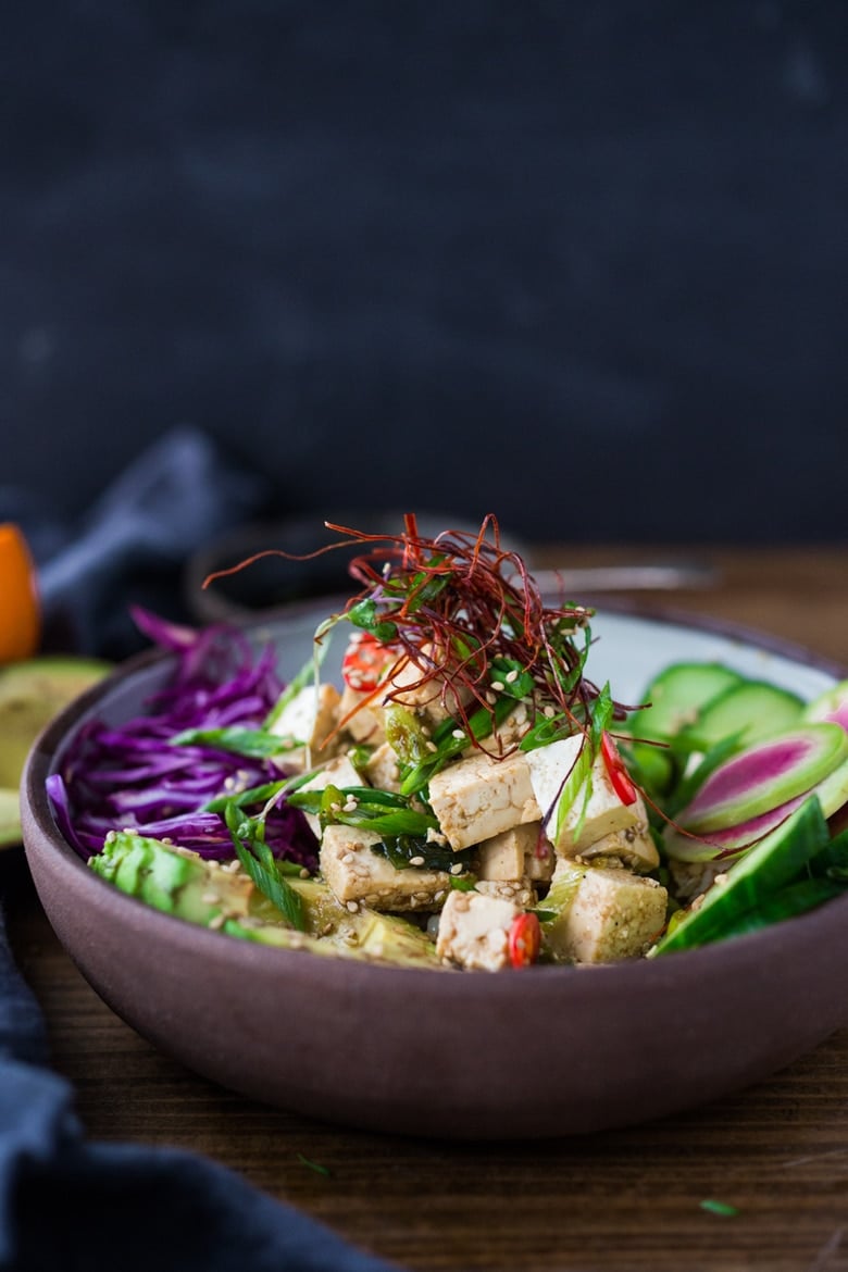 Vegan Poke Bowls made with TOFU! served over brown rice or kelp noodles, with avocado, cucumber, radish and Citrus Ponzu Sauce! | www.feastingathome.com #poke #pokerecipe #ahipoke #ahi #pokebowl #pokerecipes 