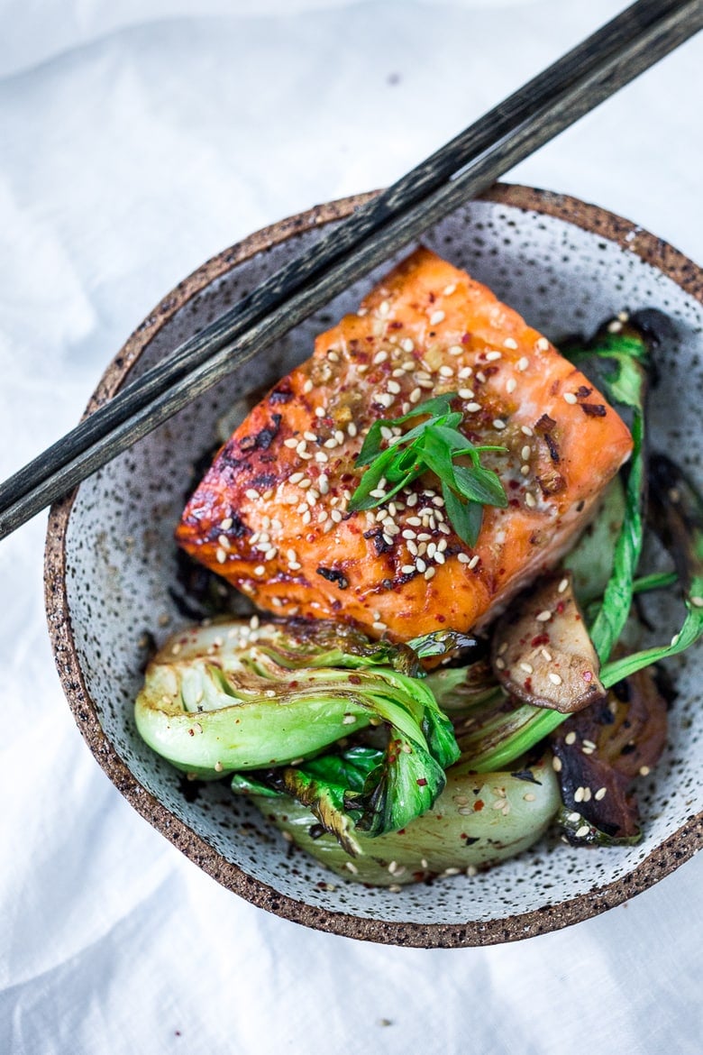 Teriyaki Salmon with Baby Bok Choy- a fast healthy sheet-pan dinner with 15 minutes of hands-on time before baking in the oven -perfect for busy weeknight dinners. #teriyakisalmon #teriyaki #bakedsalmon #roasted salmon #salmon www.feastingathome.com