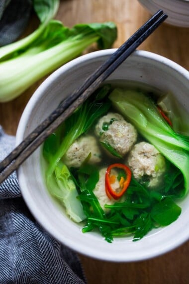 A delicious brothy Asian-style chicken meatball soup with bok choy. A delicious 30 minute meal. 