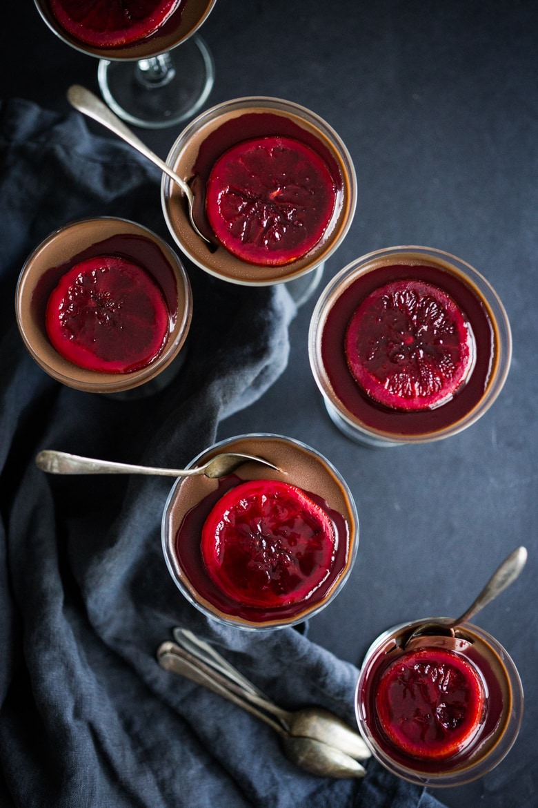 Dark Chocolate Panna Cotta with Blood Oranges- a decadent finish to your special dinner, this creamy luscious dark chocolate dessert is rich and satisfying, yet not overly sweet. Simple to make, this make ahead dessert can be brought out right after dinner, already dished up, with no hassle. | www.feastingathome.com