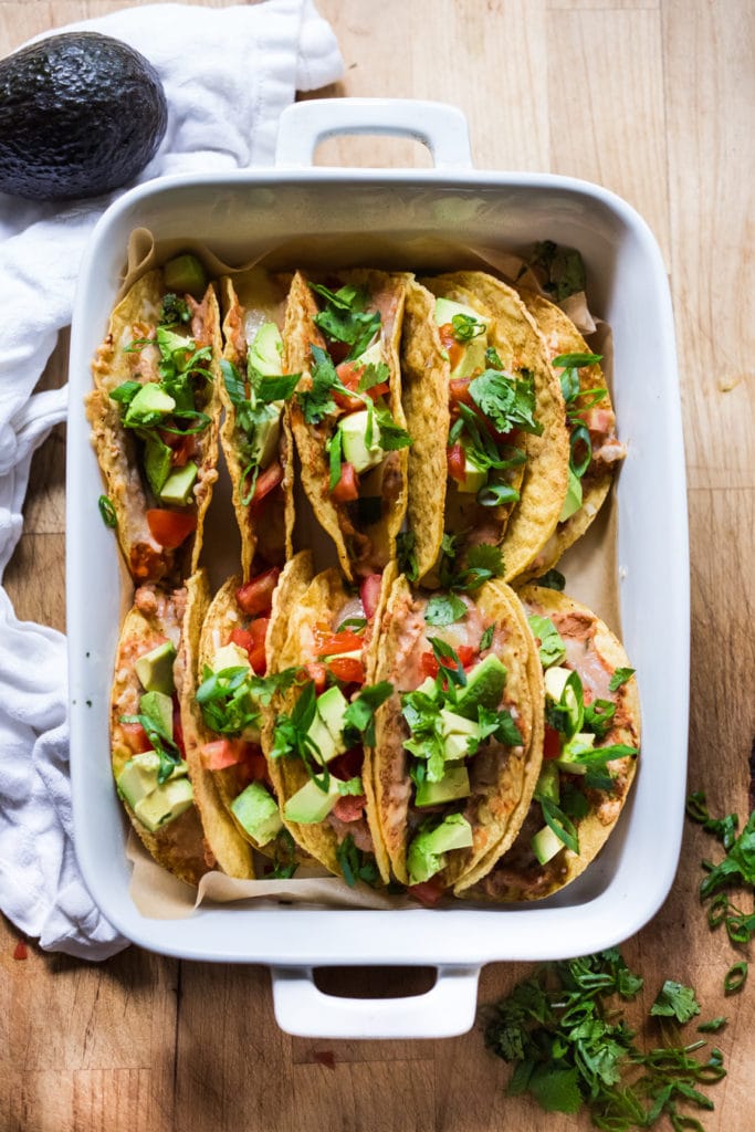 Healthy Baked Vegetarian Tacos - Kid friendly and just 15 minutes of prep before going into the oven to bake. | #tacos #bakedtacos www.feastingathome.com