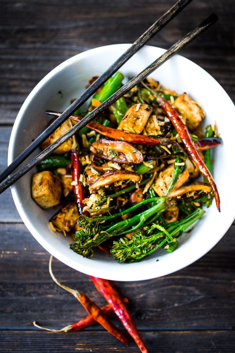 DELICIOUS Tofu Stir-Fry with Broccolini and mushrooms- a fast and easy weeknight dinner loaded up with healthy veggies and amazing flavor! | #tofustirfry #stirfry #broccoli #broccolini #vegan #weeknightdinner #veganstrifry #tofurecipes www.feastingathome.com