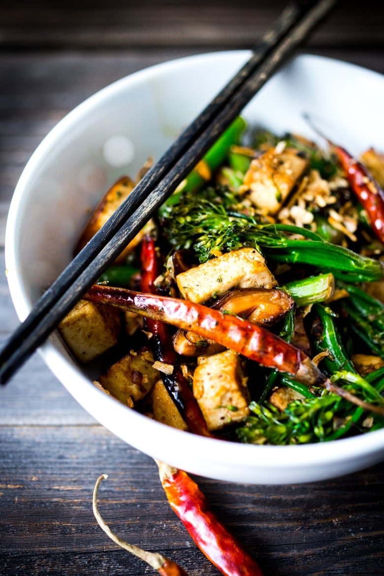 DELICIOUS Tofu Stir-Fry with Broccolini and mushrooms- a fast and easy weeknight dinner loaded up with healthy veggies and amazing flavor! | #tofustirfry #stirfry #broccoli #broccolini #vegan #weeknightdinner #veganstrifry #tofurecipes www.feastingathome.com