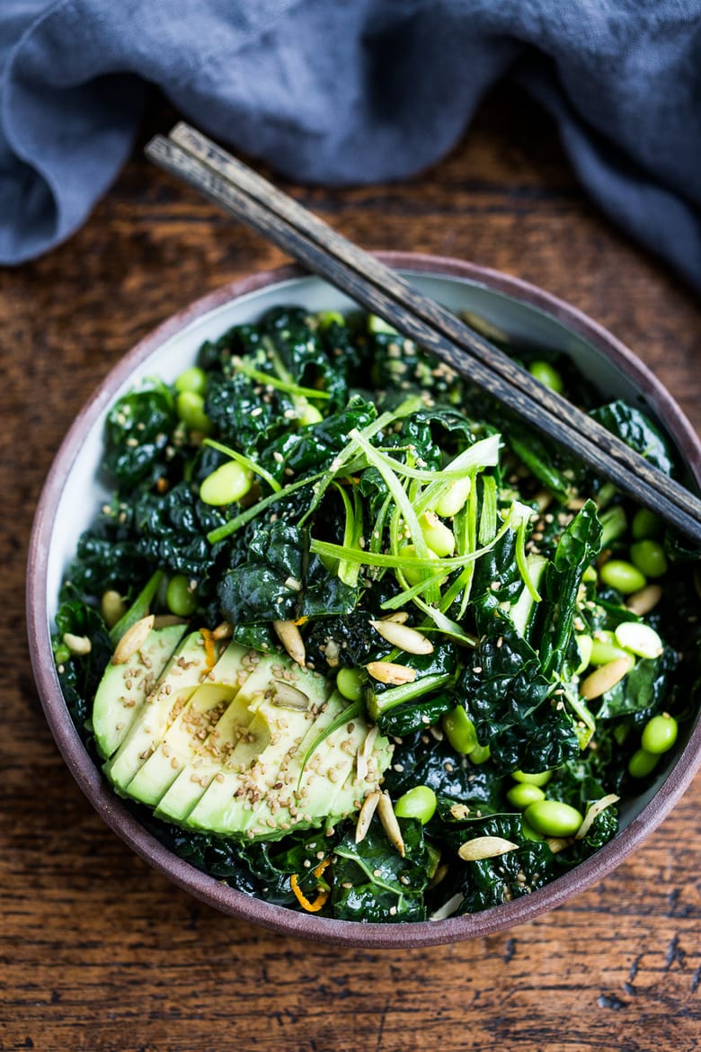 Emerald Kale Salad w/ Sesame Ginger Dressing, Avocado, edamame, scallions, pumpkin seeds and orange zest. Add seared tofu and turn it into dinner! | www.feastingathome.com #vegan #kale #salad #glutenfree