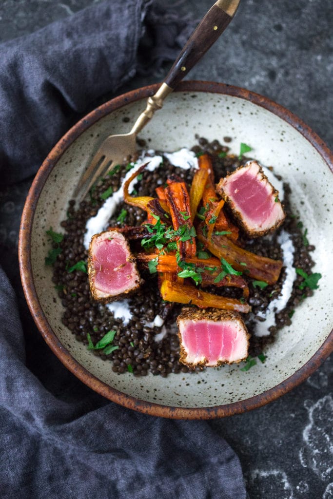 seared ahi tuna over Moroccan lentils with roasted carrots and yogurt drizzle.