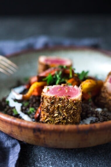 Seared Ahi served over Moroccan Lentils with roasted baby carrots, fresh herbs and yogurt drizzle. #searedahi #lentils