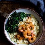 Portuguese Shrimp and Cauliflower "Grits"- with garlicky kale. A fast delicious dinner that is vegan adaptable and gluten free! | www.feastingathome.com