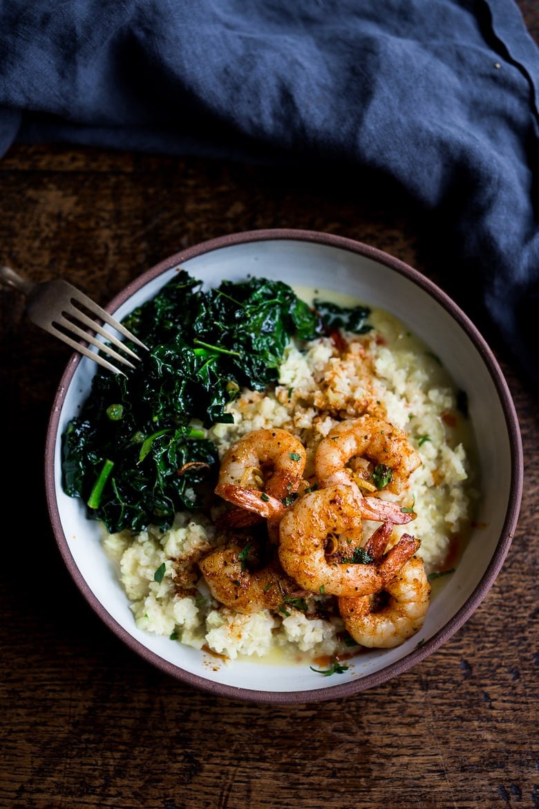 Portuguese Prawns and Cauliflower "Grits"- with garlicky kale. A fast delicious dinner that is vegan adaptable and gluten free! | www.feastingathome.com
