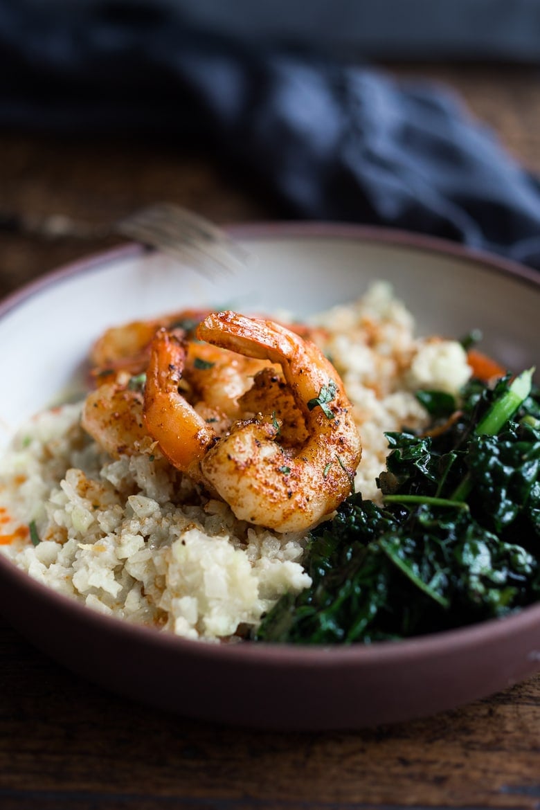 Portuguese Shrimp and Cauliflower "Grits"- with garlicky kale. A fast delicious dinner that is vegan adaptable and gluten free! | www.feastingathome.com