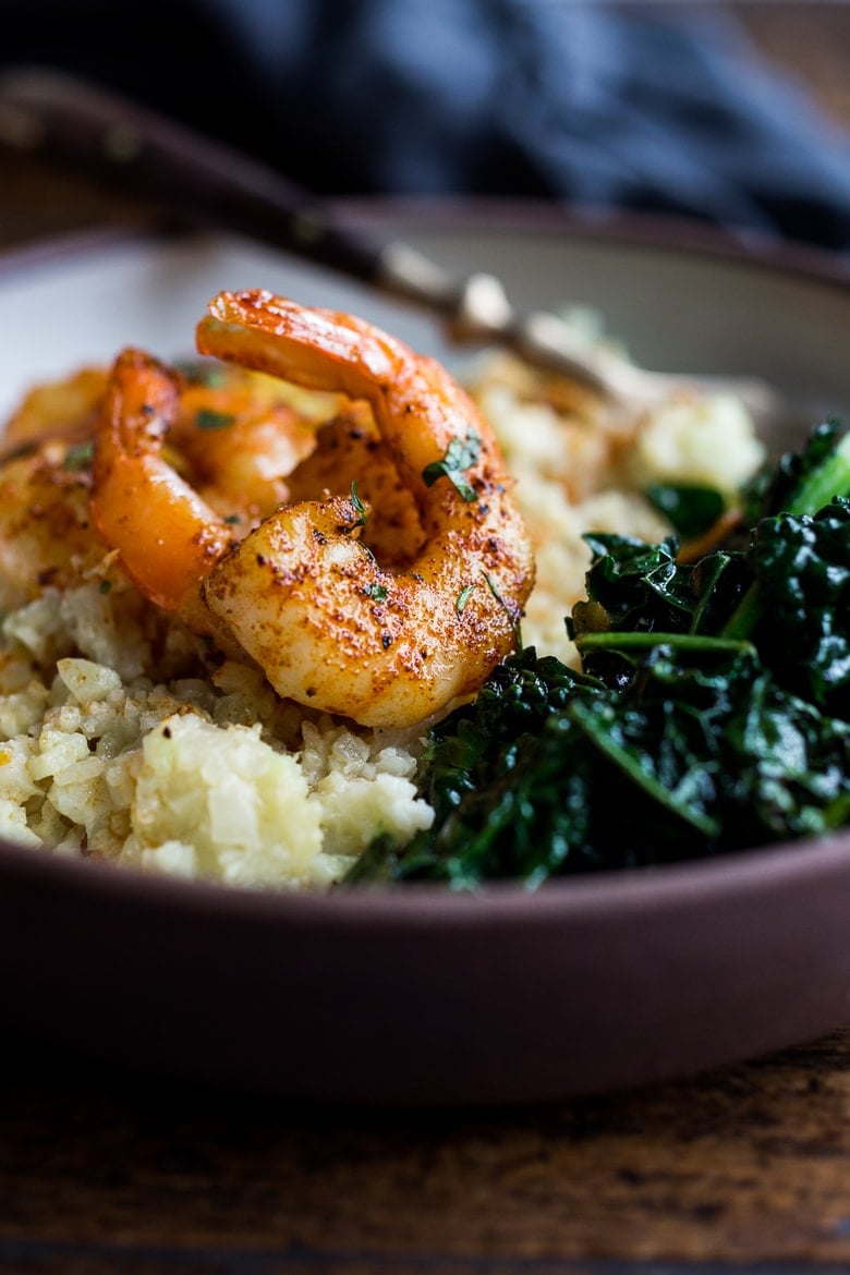 Portuguese Shrimp and Cauliflower "Grits"- with garlicky kale. A fast delicious dinner that is vegan adaptable and gluten free! | www.feastingathome.com