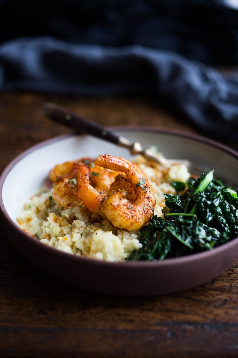 Portuguese Shrimp and Cauliflower "Grits"- with garlicky kale. A fast delicious dinner that is vegan adaptable and gluten free! | www.feastingathome.com