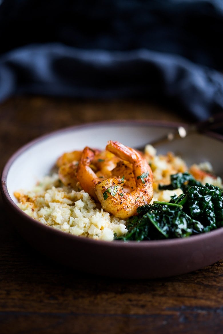 Portuguese Shrimp and Cauliflower "Grits"- with garlicky kale. A fast delicious dinner that is vegan adaptable and gluten free! | www.feastingathome.com