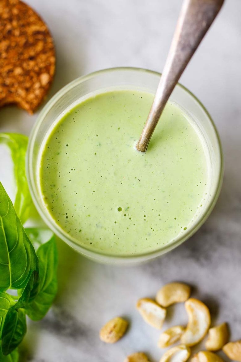 Creamy Cashew Basil Dressing - tangy, creamy, vegan and full of summer flavor. Use on crispy-crunchy lettuces like romaine and little gems and perfect with summer tomatoes.