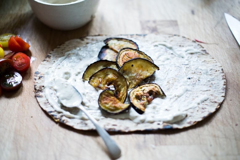 Middle Eastern Eggplant Wrap with a lemony Kale Parsley Mint Slaw with Creamy Tahini Sauce. Keep it vegan or add feta! | www.feastingathome.com