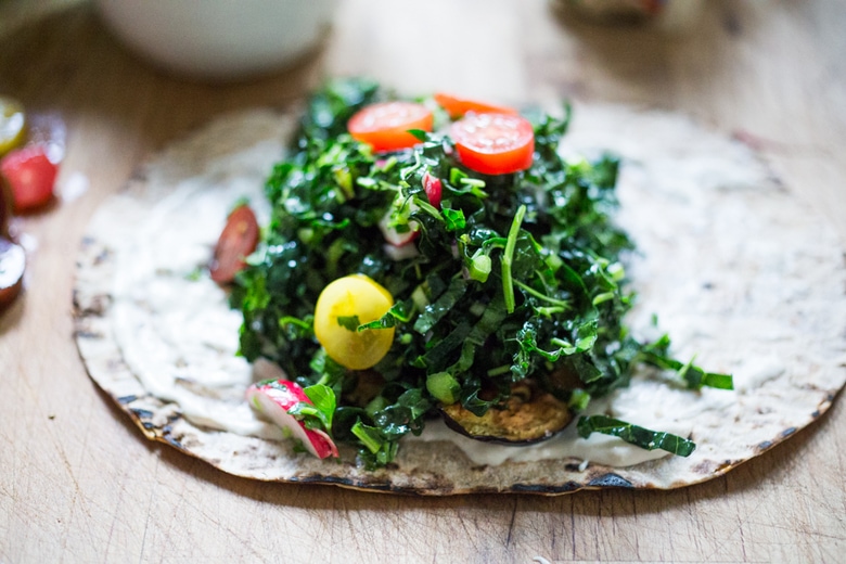 Middle Eastern Eggplant Wrap with a lemony Kale Parsley Mint Slaw with Creamy Tahini Sauce. Keep it vegan or add feta! | www.feastingathome.com