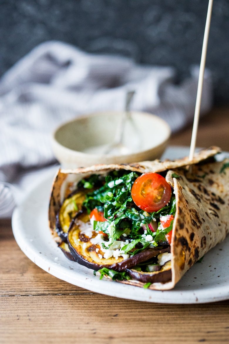 Middle Eastern Eggplant Wrap with a lemony Kale Parsley Mint Slaw with Creamy Tahini Sauce. Keep it vegan or add feta! | www.feastingathome.com