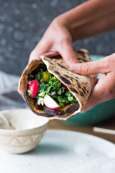 Middle Eastern Eggplant Wrap with a lemony Kale Parsley Mint Slaw with Creamy Tahini Sauce. Keep it vegan or add feta! | www.feastingathome.com