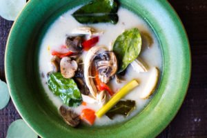 Authentic Tom Kha Gai Soup (Thai Coconut Chicken Soup) - a healthy, delicious and easy recipe that can be made in an Instant Pot or on the stove top. Vegan Adaptable! #tomkha #thaisoup #tomkhagai #paleo #keto #thaichickensoup #galangal #coconutsoup #traditional