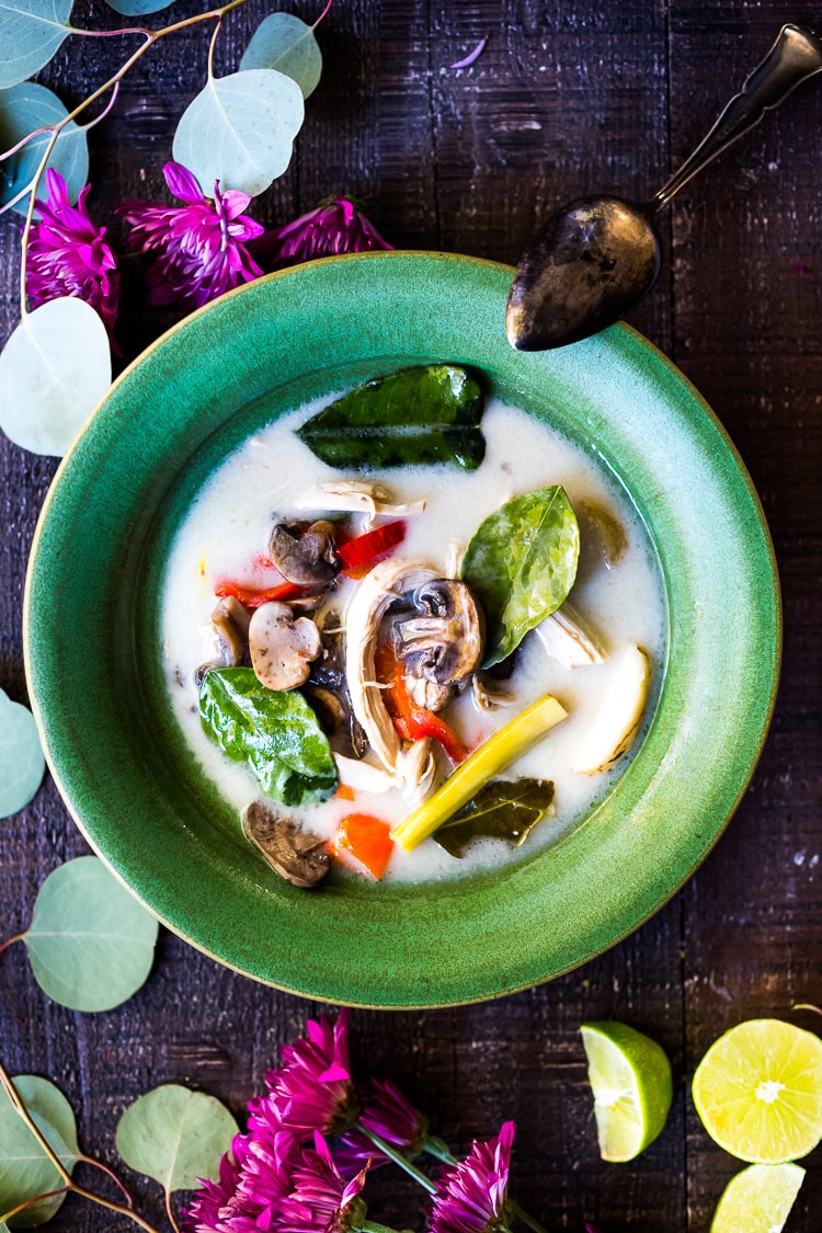 Authentic Tom Kha Gai Soup (Thai Coconut Chicken Soup) - a healthy, delicious and easy recipe that can be made in an Instant Pot or on the stove top. Vegan Adaptable! #tomkha #thaisoup #tomkhagai #paleo #keto #thaichickensoup #galangal #coconutsoup #traditional 