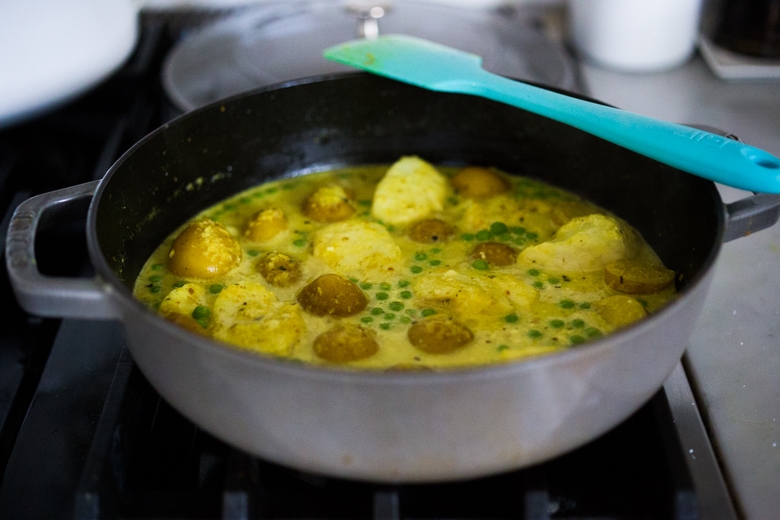 Balinese Fish Curry with potatoes, spring veggies, lime and mint in a fragrant curry sauce.| www.feastingathome.com 