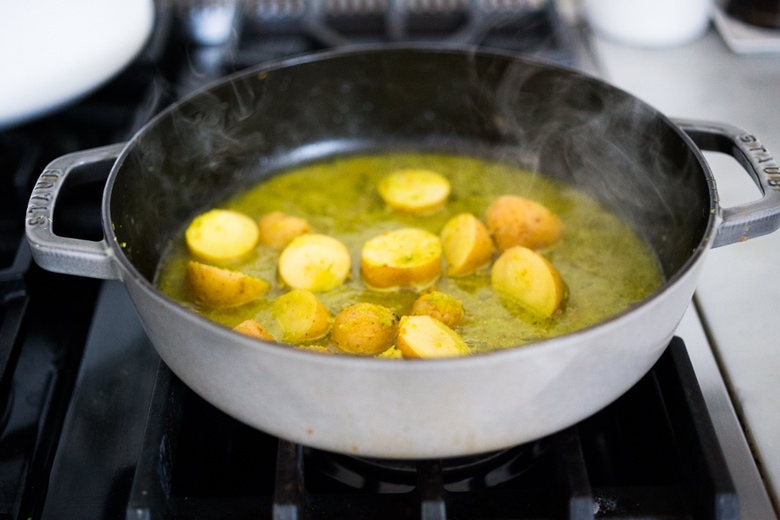 Balinese Fish Curry with potatoes, spring veggies, lime and mint in a fragrant curry sauce.| www.feastingathome.com 