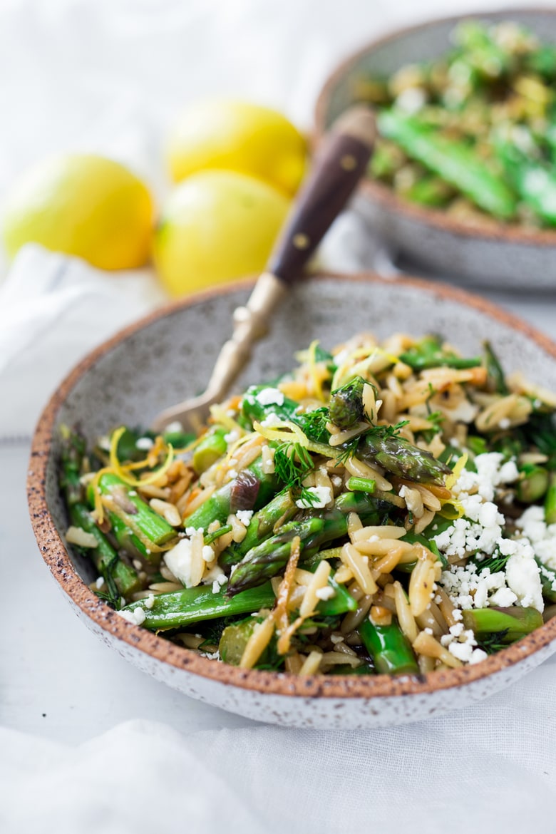 This recipe for Lemon Orzo with Asparagus- is perfect for spring! Quick and easy, serve this spring pasta "warm" as a dinner,  or chilled as a side salad. Vegan adapatable.