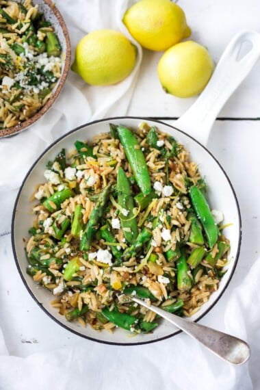 This recipe for Lemon Orzo with Asparagus- is perfect for spring! Quick and easy, serve this spring pasta "warm" as a dinner,  or chilled as a side salad. Vegan adapatable.