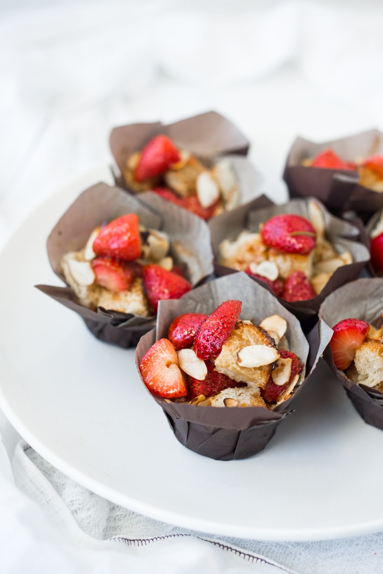 French Toast Muffins with Strawberries and Almonds- a perfect beginning to Easter Brunch or Mother's Day Brunch. Simple and easy to make! | www.feastingathome.com